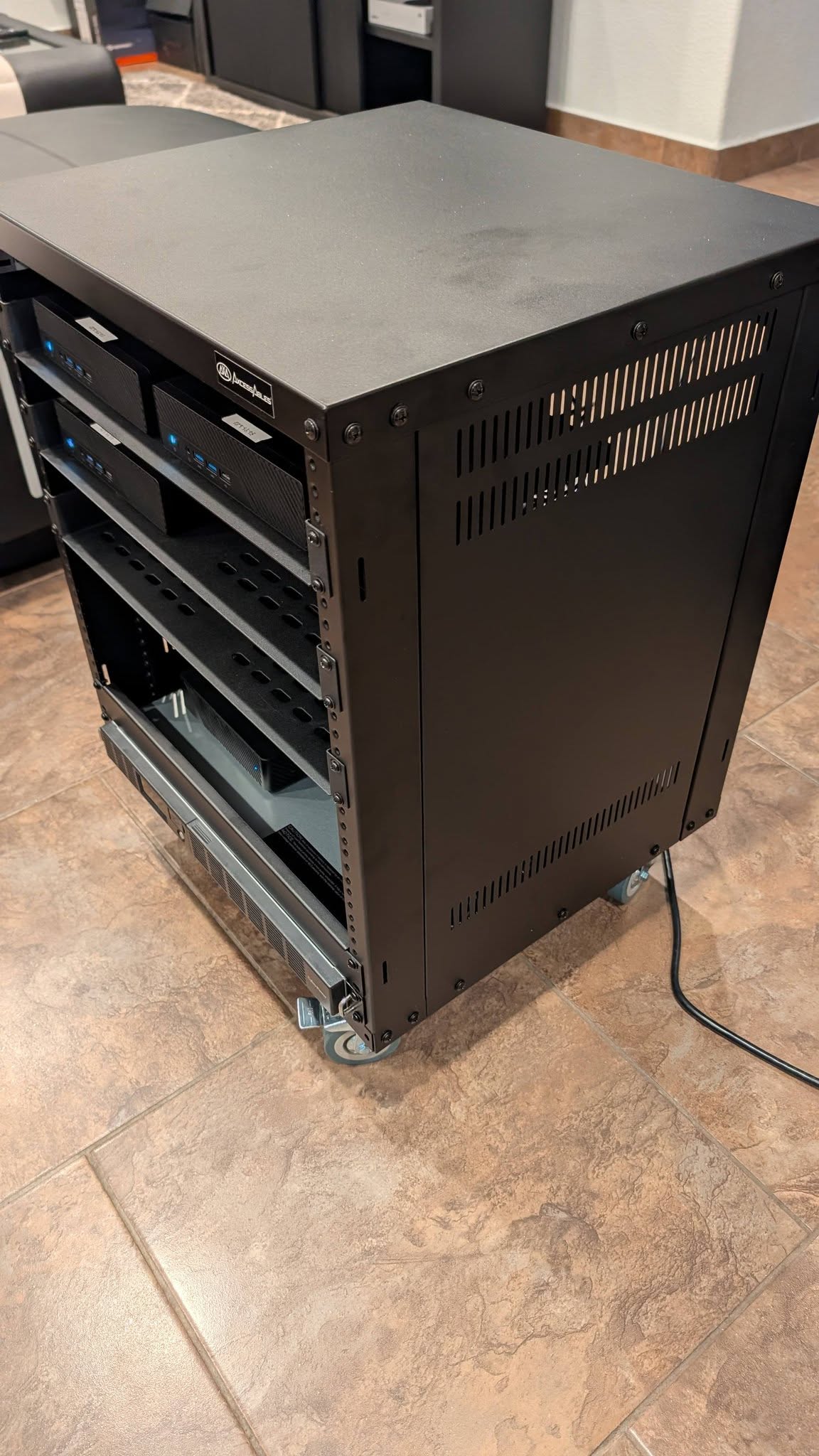 Angled exterior view of the completed rack enclosure on wheels.