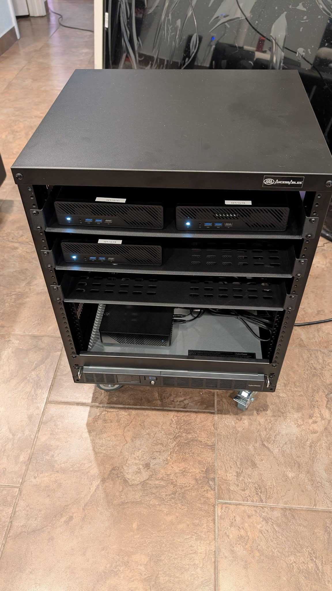 Front view of the installed mini-PC nodes and lower rack components in the final infrastructure build.