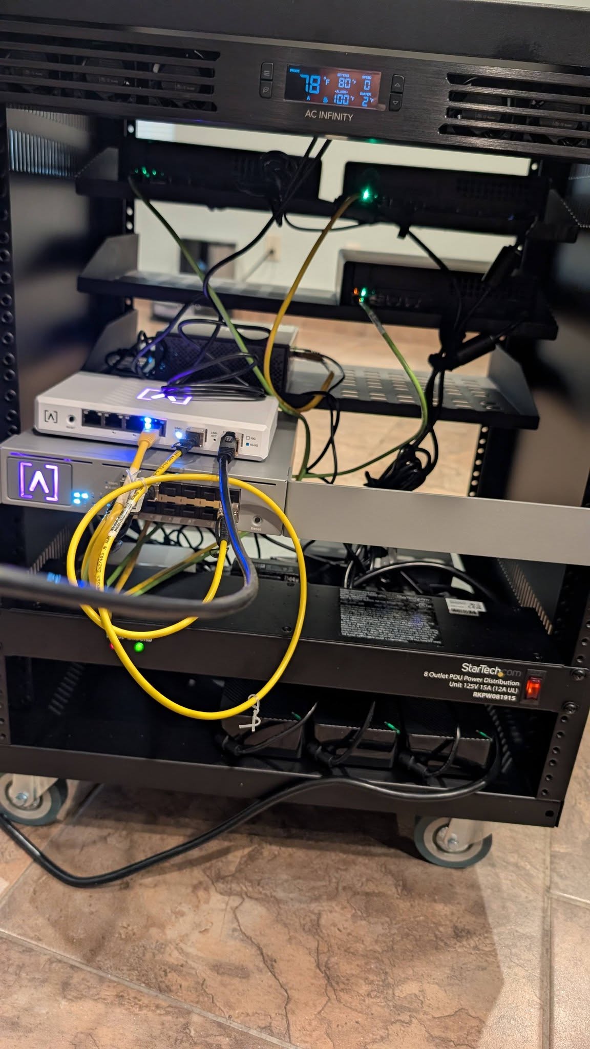 Open front view of the completed on-prem rack with networking, power, and mounted hardware installed.
